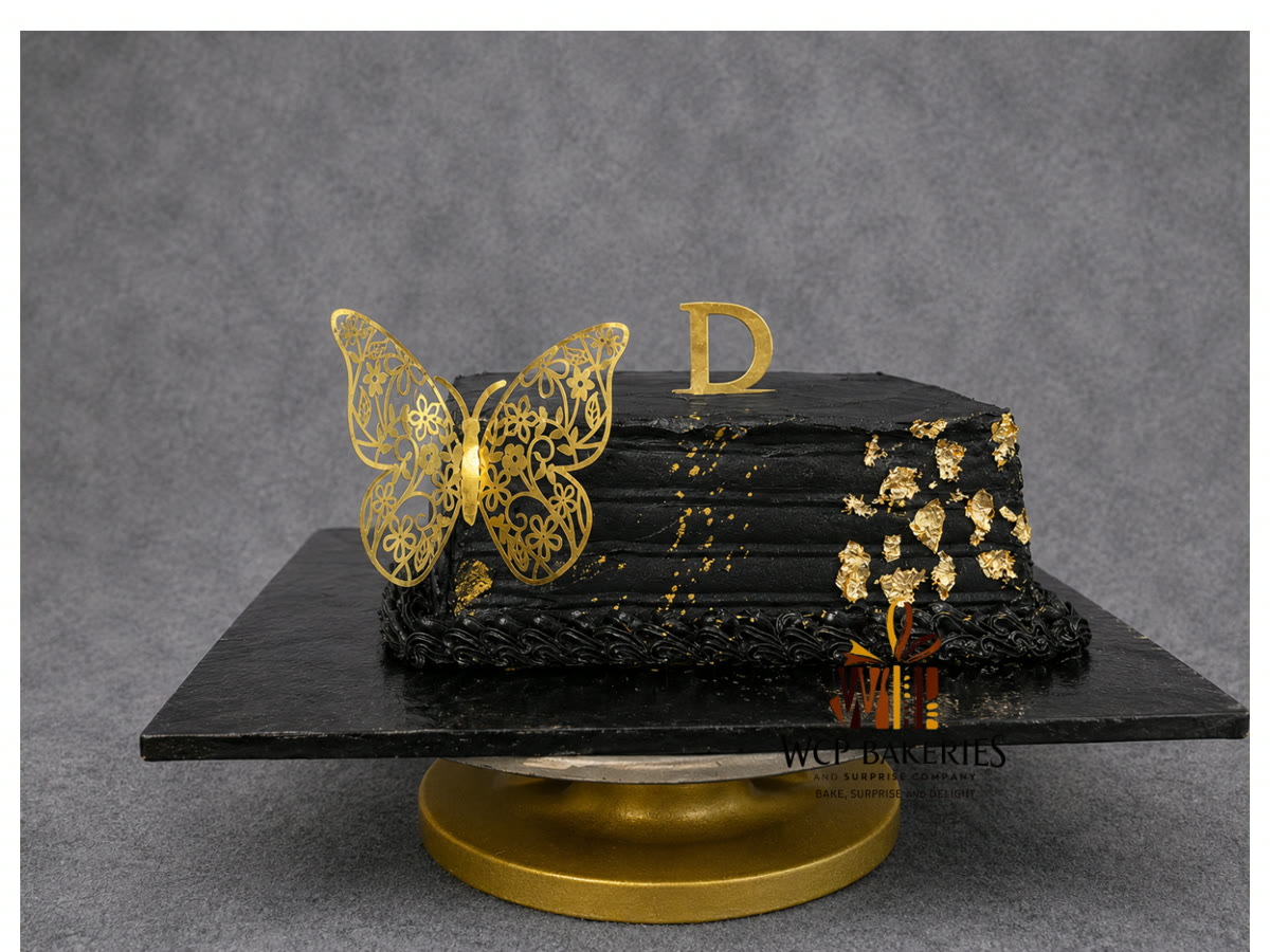 Black graduation cap cake with gold butterfly