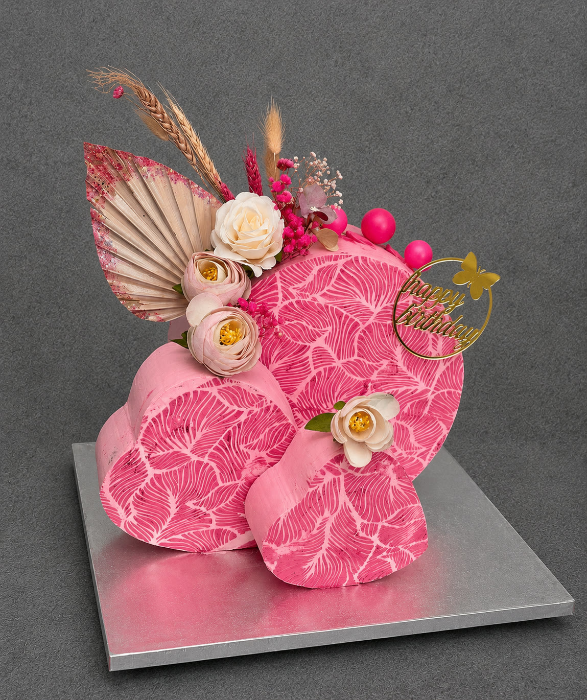 Pink number 8 cake with flowers and gold butterflies