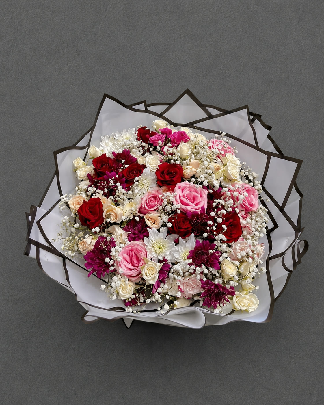 Large bouquet of red, pink and white roses